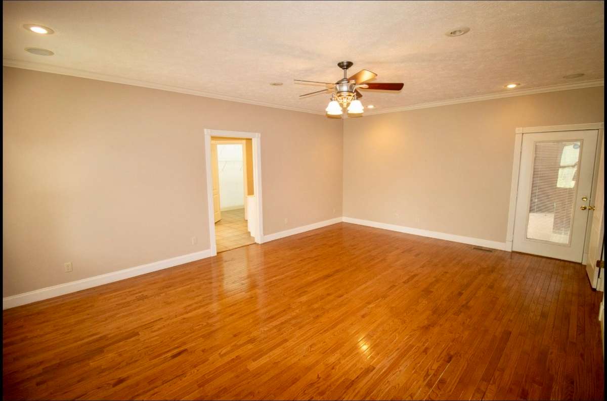 Huge 20X15 Primary Suite with access to back covered patio.