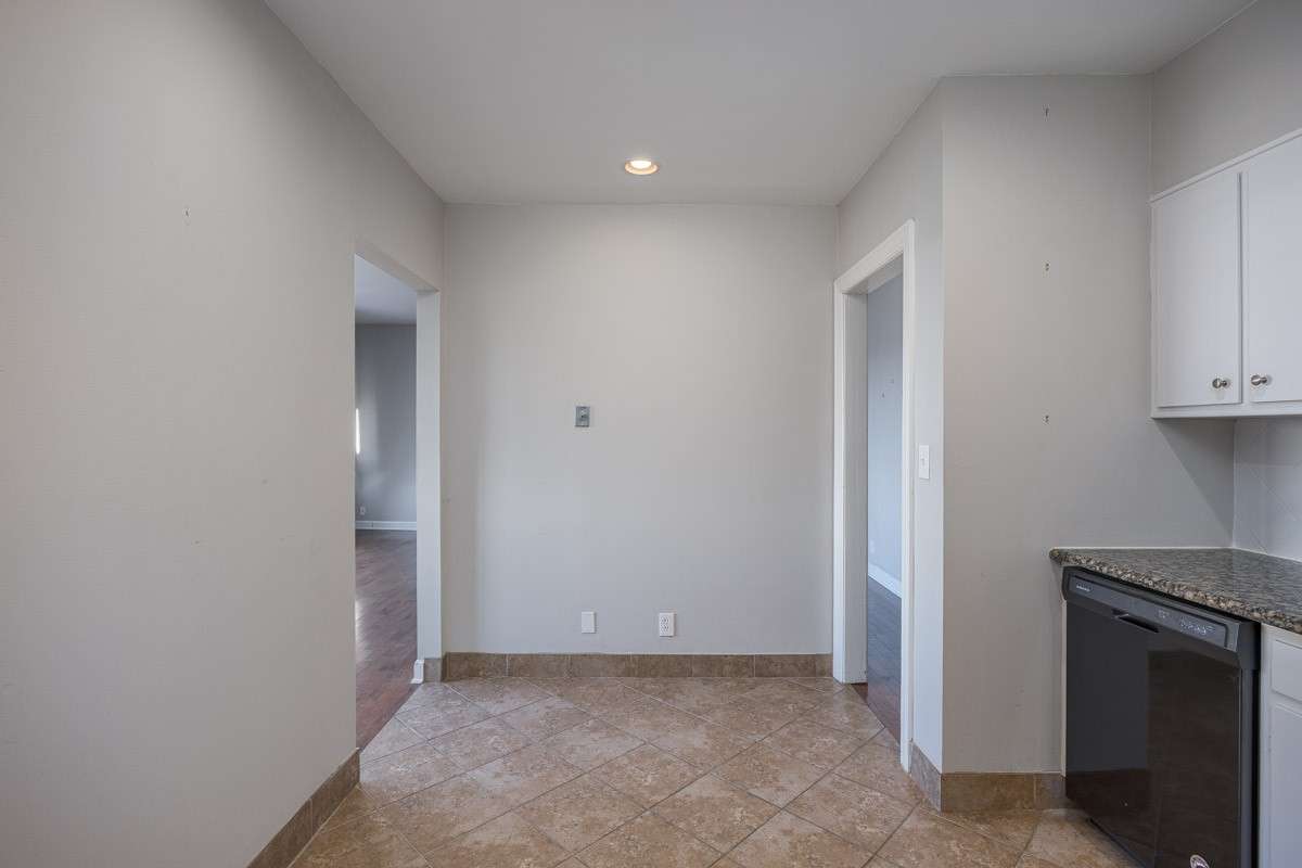 opening to the left goes to dining area; opening to the right goes toward the front door