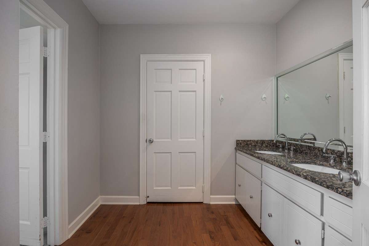 First thing you come to is a dual vanity SECONDARY sink! Through the closed door is a walk-in closet, and to the left is the bedroom. I call this area the dressing room