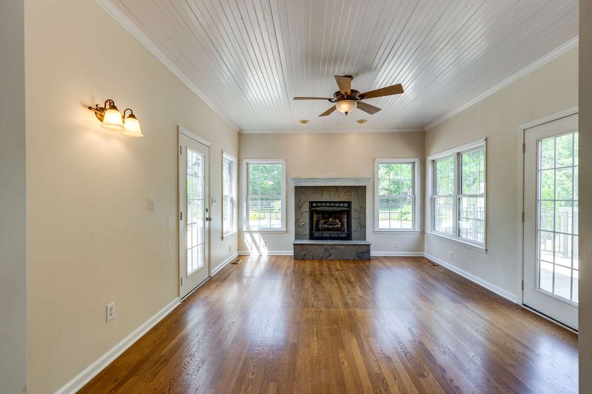 Sun Room with Beadboard Ceiling & Gas Fireplace - Enter onto Deck on both Sides