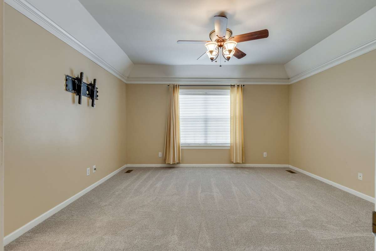Primary Suite which is at a Weird Angle in this Pic - The Room is more Square than Rectangle