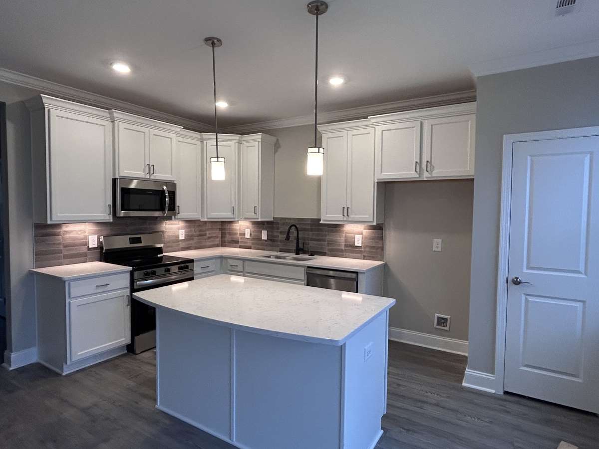 Gorgeous kitchen with eat-at island
THIS PHOTO IS OF A PREVIOUSLY BUILT SIMILAR PROPERTY. THE FINISHES IN THIS UNIT MAY DIFFER.