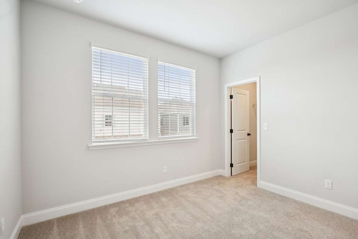 ***Photo taken from a previously built Esplanade townhouse. Professional photos coming soon for this property.***

Bedroom #2
