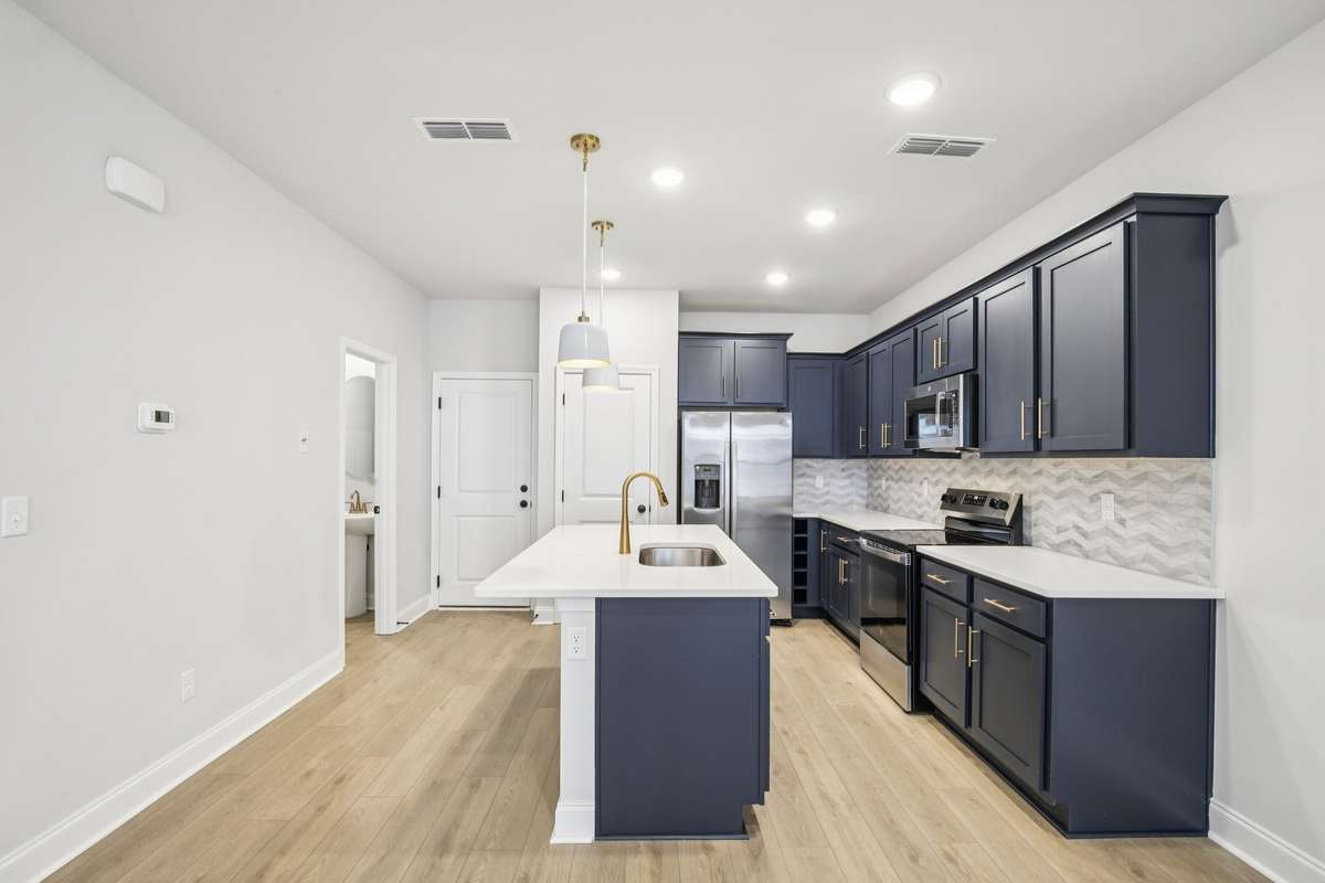 ***Photo taken from a previously built Esplanade townhouse. Professional photos coming soon for this property.***

Kitchen