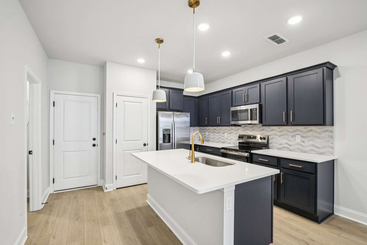 ***Photo taken from a previously built Esplanade townhouse. Professional photos coming soon for this property.***

Kitchen