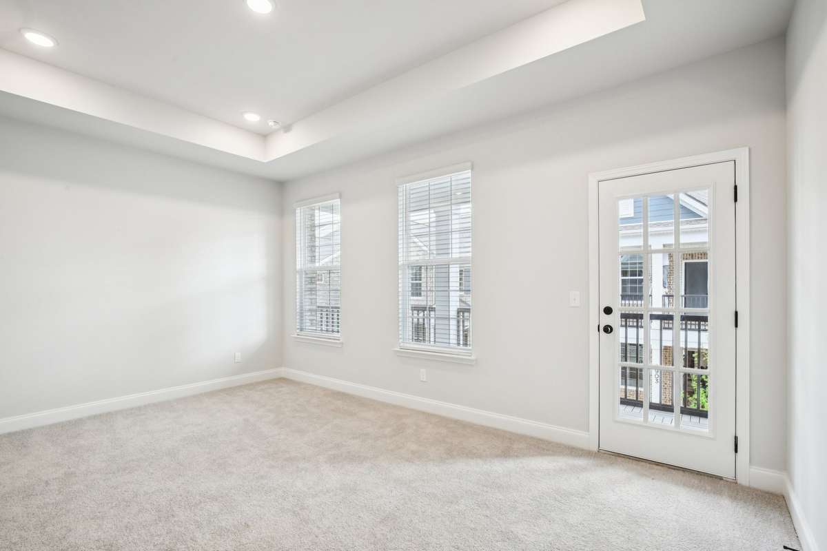 ***Photo taken from a previously built Esplanade townhouse. Professional photos coming soon for this property.***

Primary Bedroom