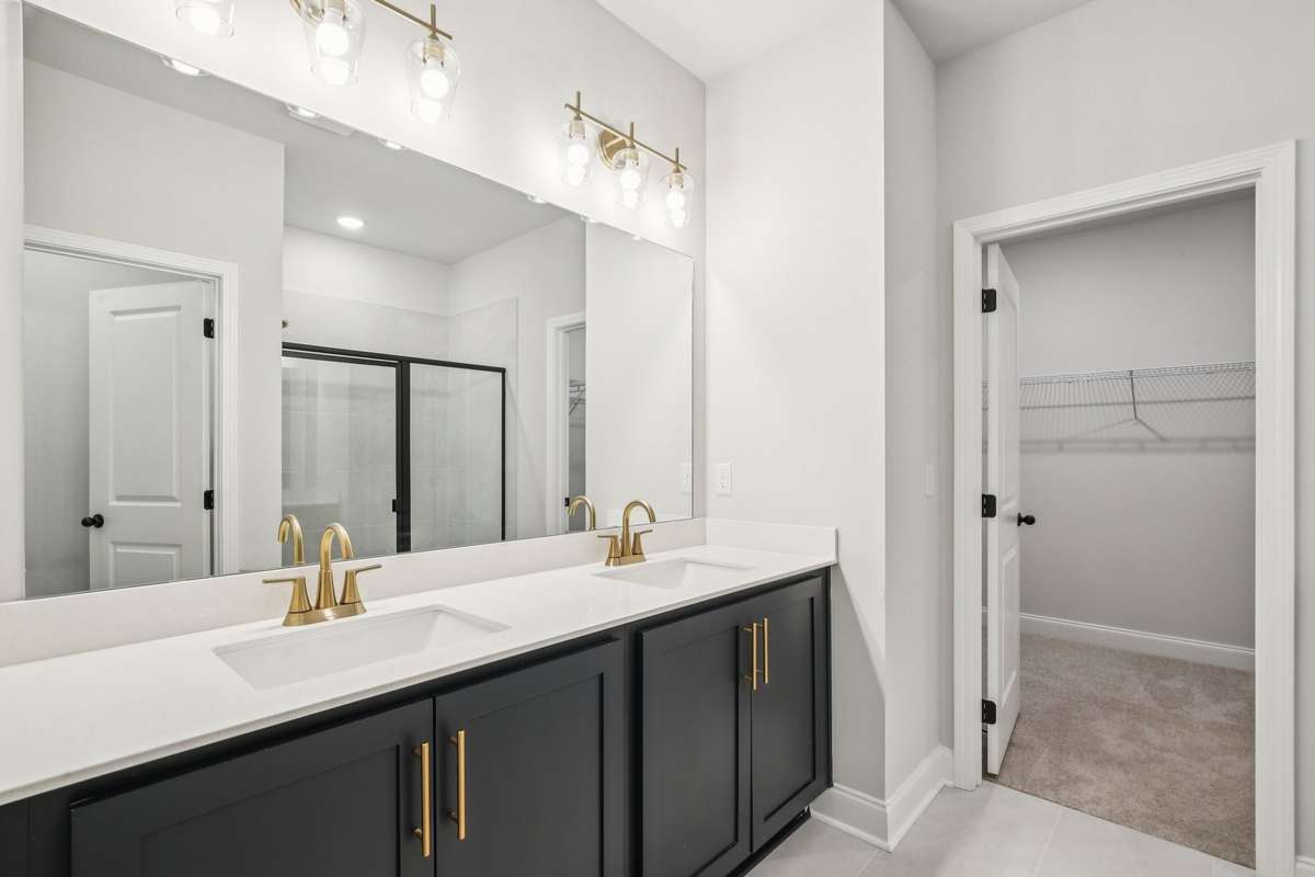 ***Photo taken from a previously built Esplanade townhouse. Professional photos coming soon for this property.***

Primary Bathroom