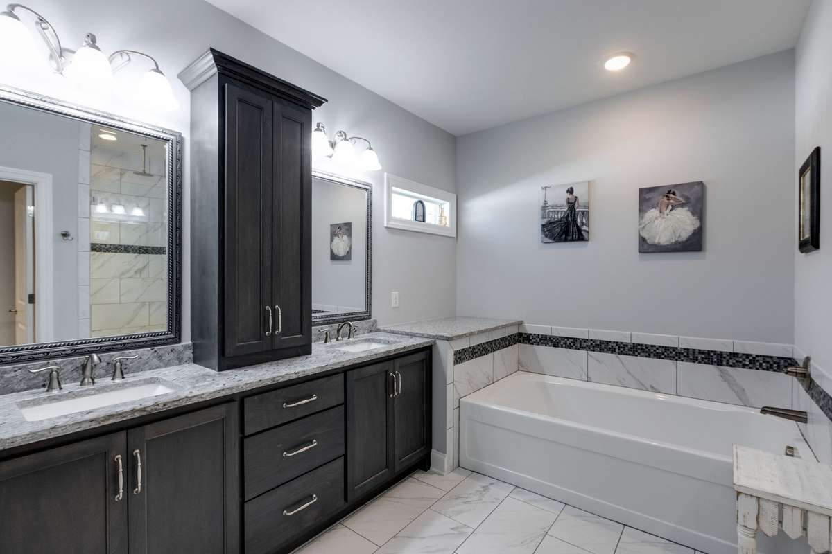 Double vanities and ample cabinets for all your storage needs.