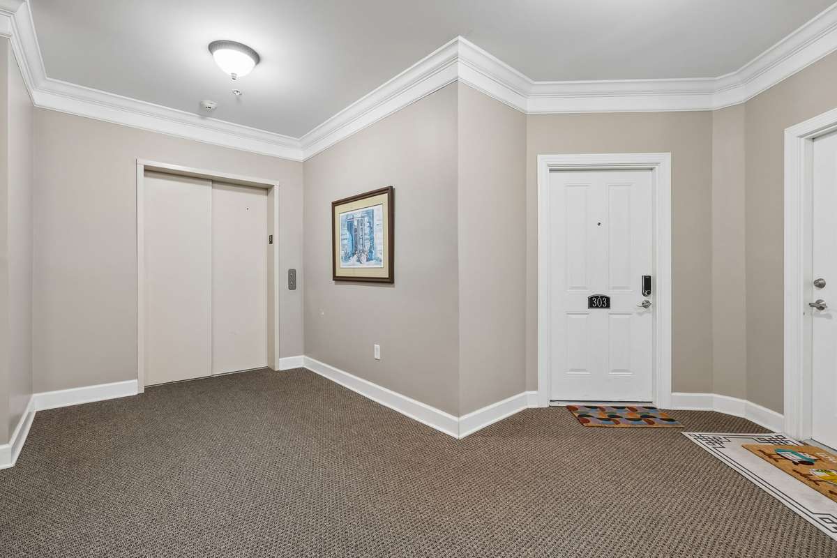 Unit 303 is a short distance to the elevator!