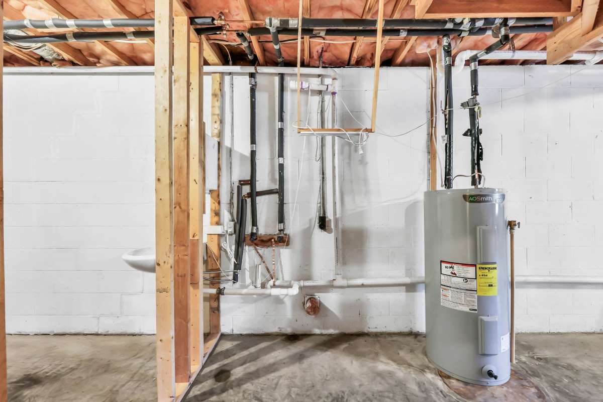 Laundry hookups - new  water heater (On left side plumbed with sink - could add half bath here