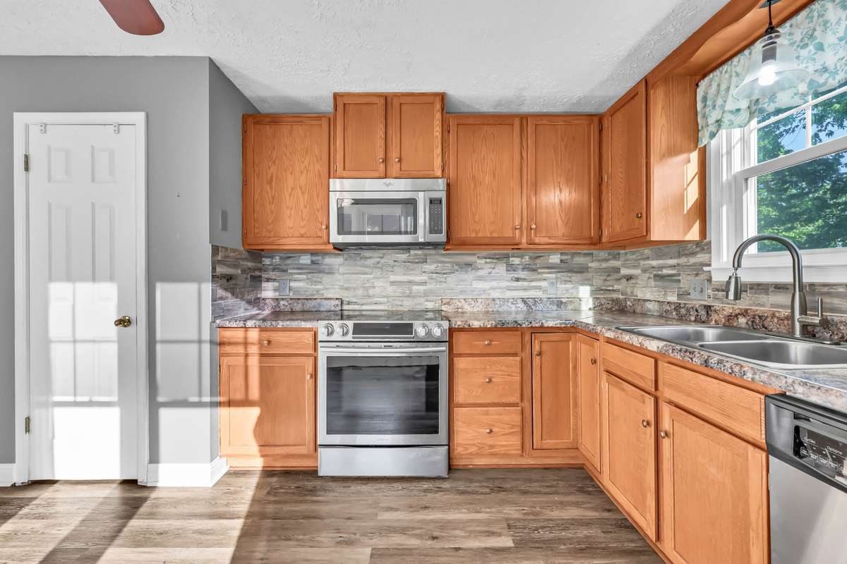 Updated appliances/cabinets/tile backsplash & countertops