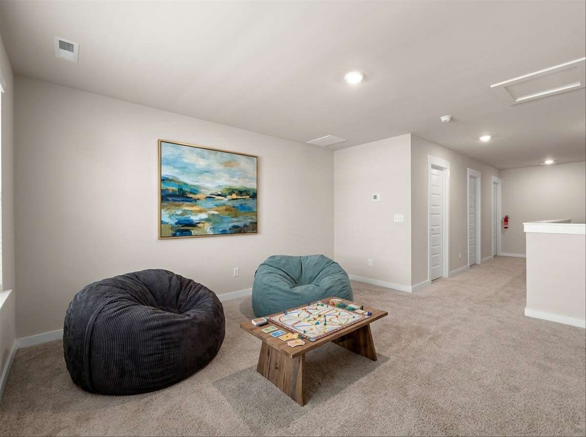 Virtual staging as an extra seating area in loft upstairs