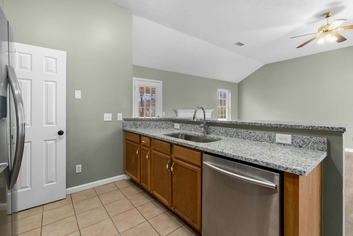 The expansive breakfast bar, designed to seat up to five, overlooks the family room and encourages seamless entertaining.