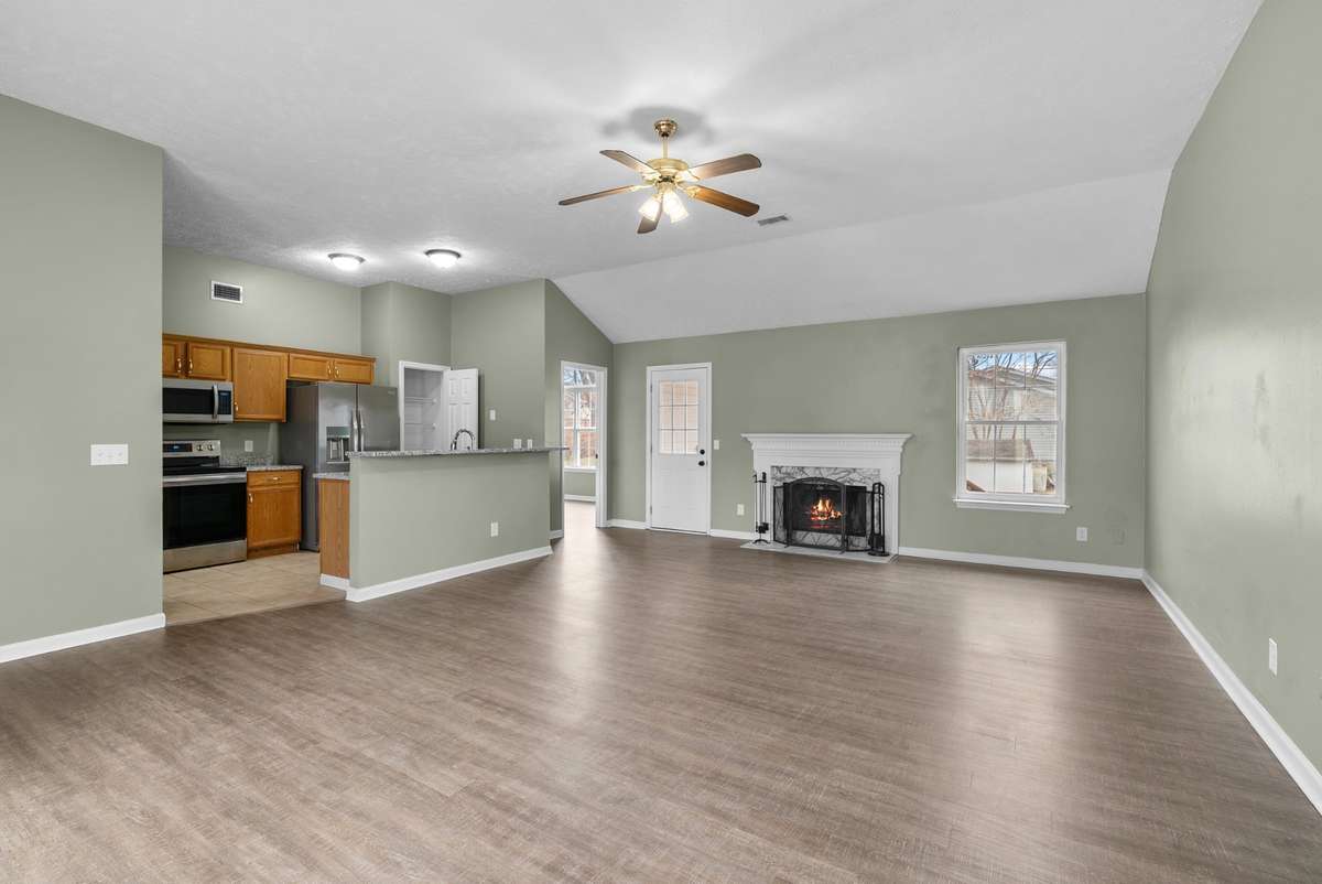 High ceilings elevate the room’s openness, while a ceiling fan and direct
access to the covered deck create an effortless blend of comfort and functionality.