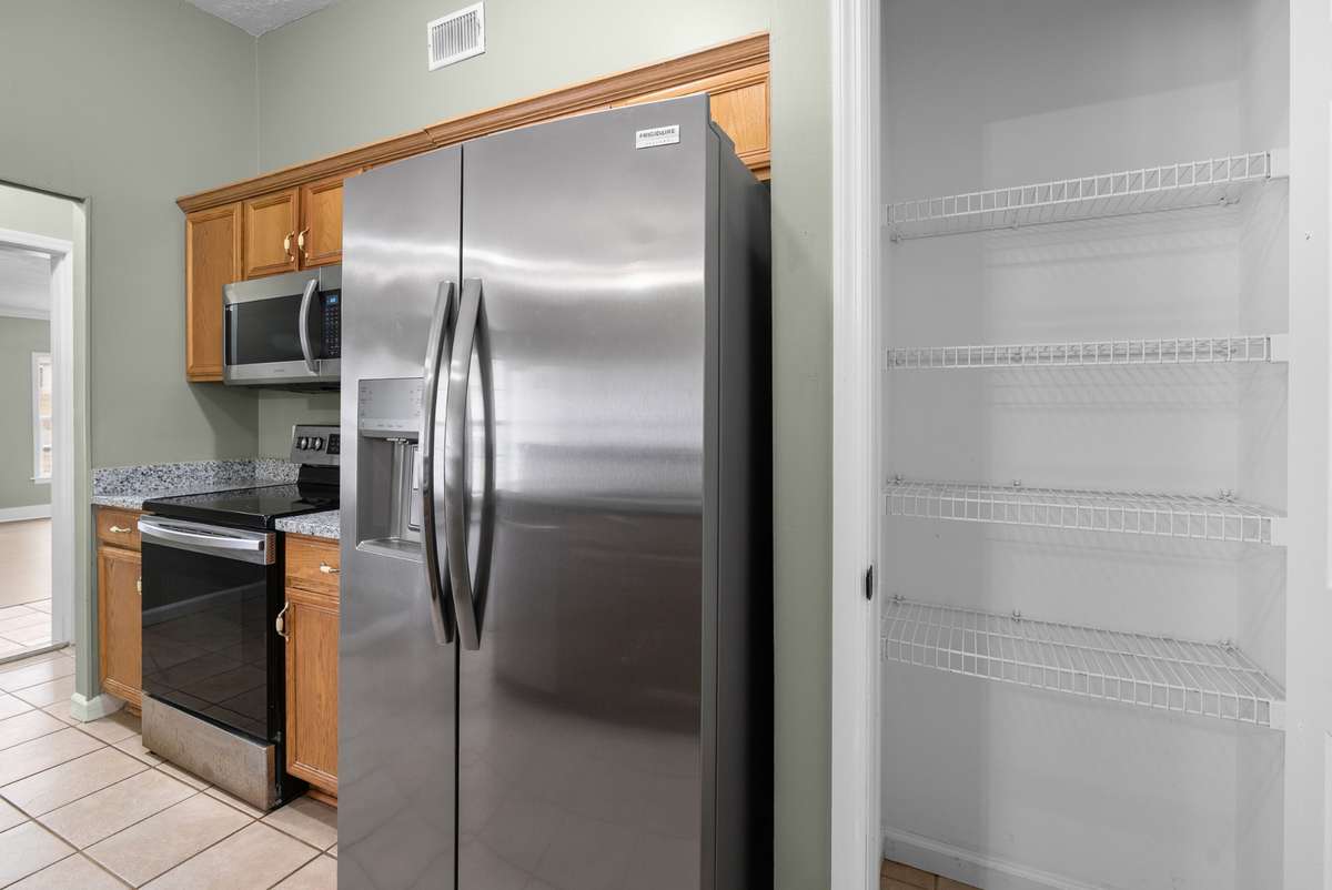 Don’t miss the nearby pantry which provides excellent storage.