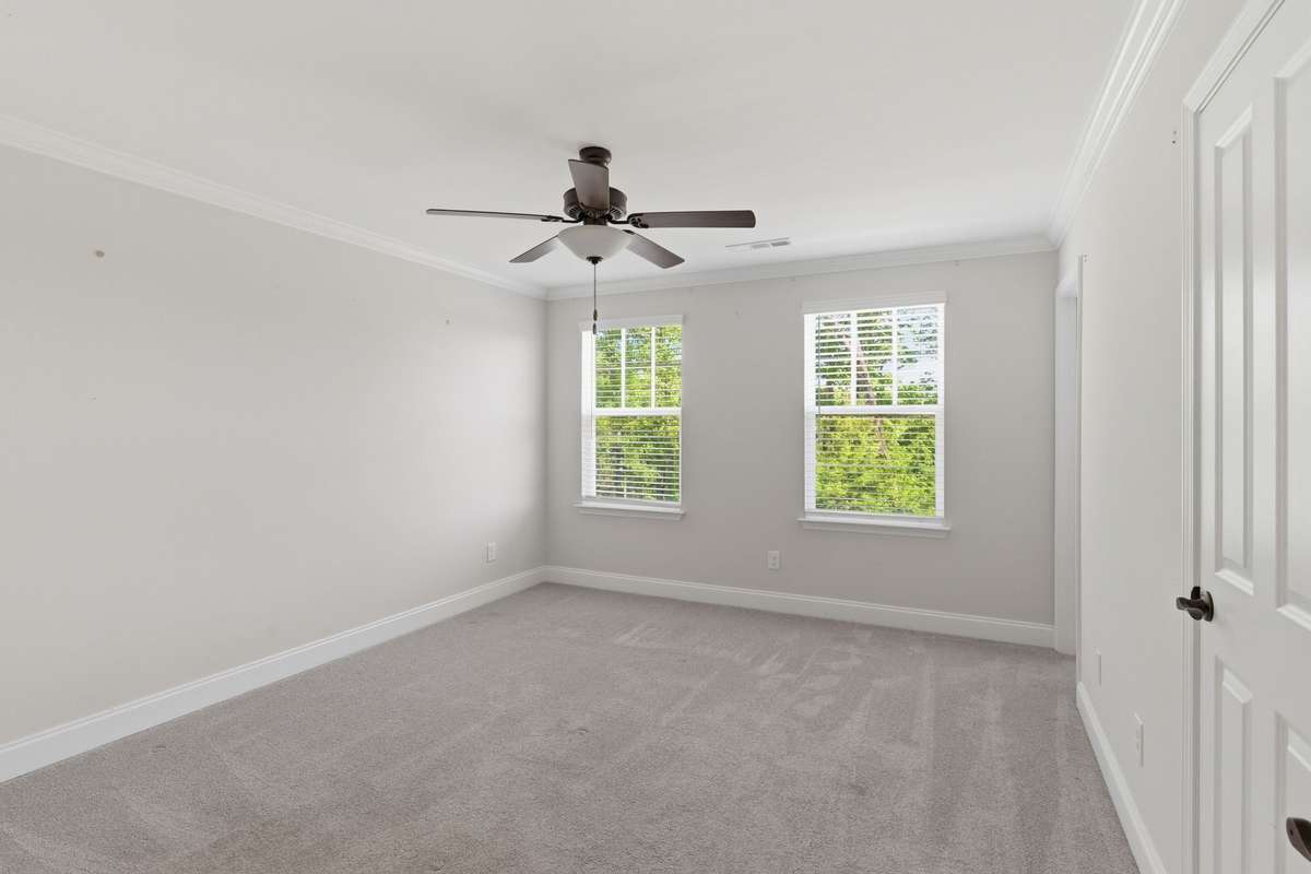 Primary bedroom with two walk-in closets and ensuite bath