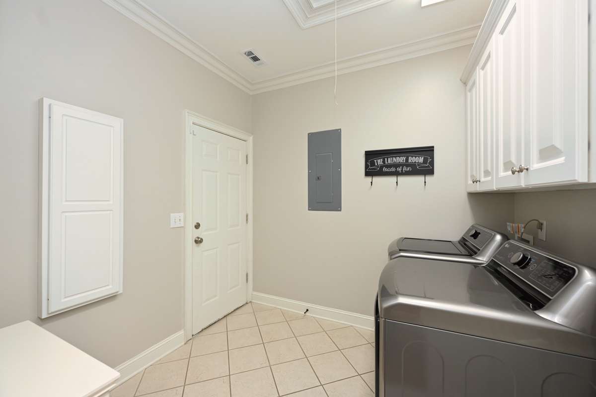 Spacious Laundry Room w/ pull down Attic Space for extra storage