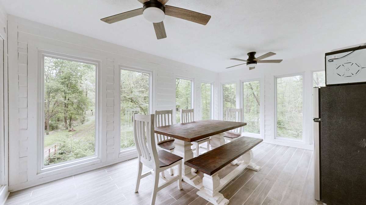 All season sunroom on the main level... currently being used as a dining room