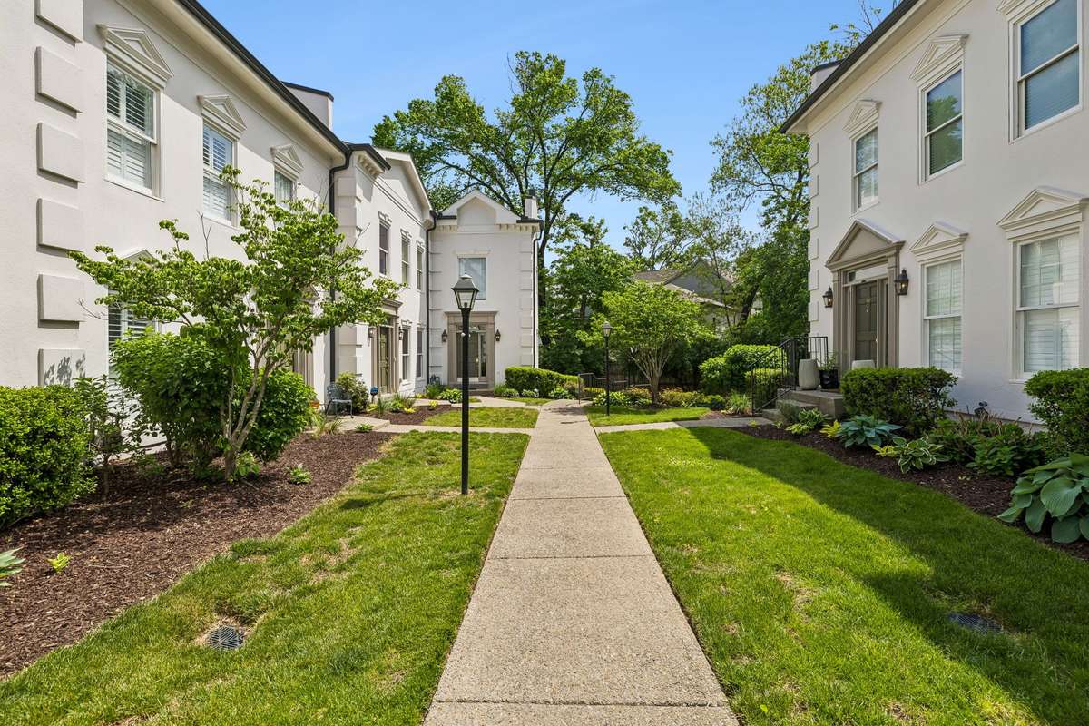 From guest parking take the sidewalk to 3037 Woodlawn on your right.  Beautifully landscaped townhome with newly painted stucco exterior!