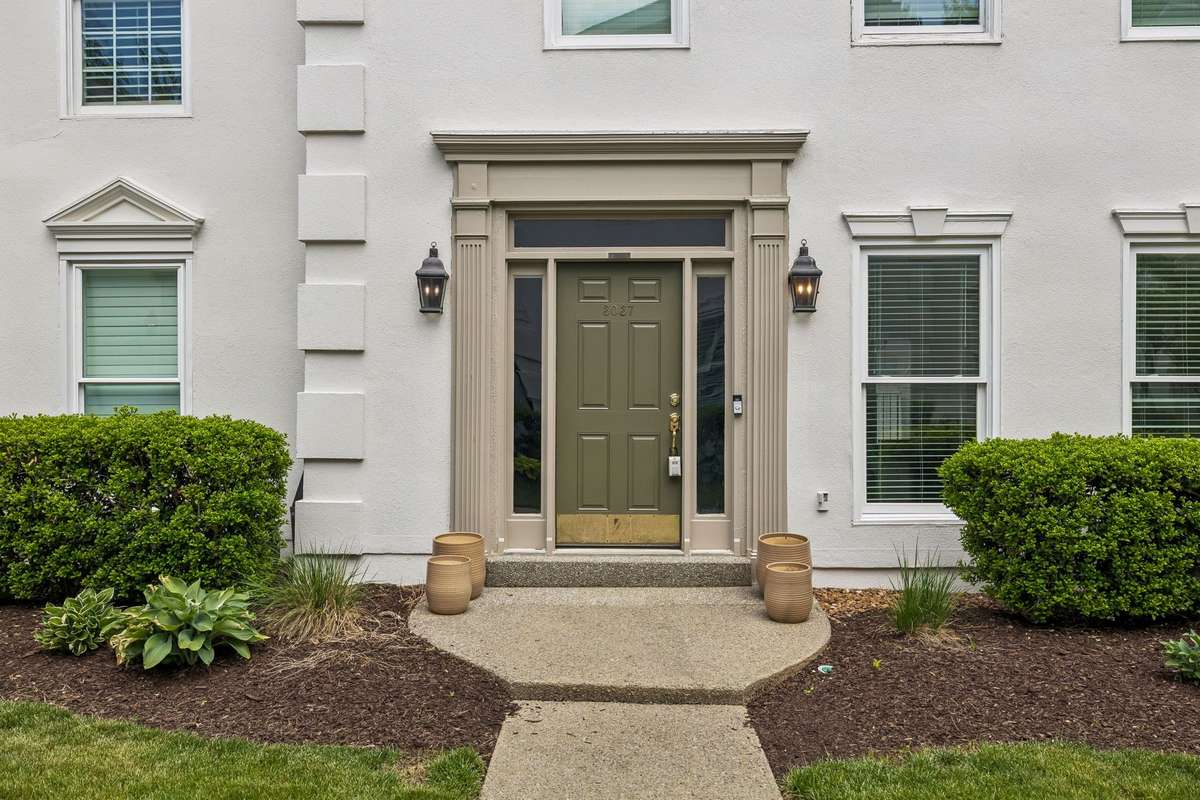 Stately entrance to lovely traditional townhome.