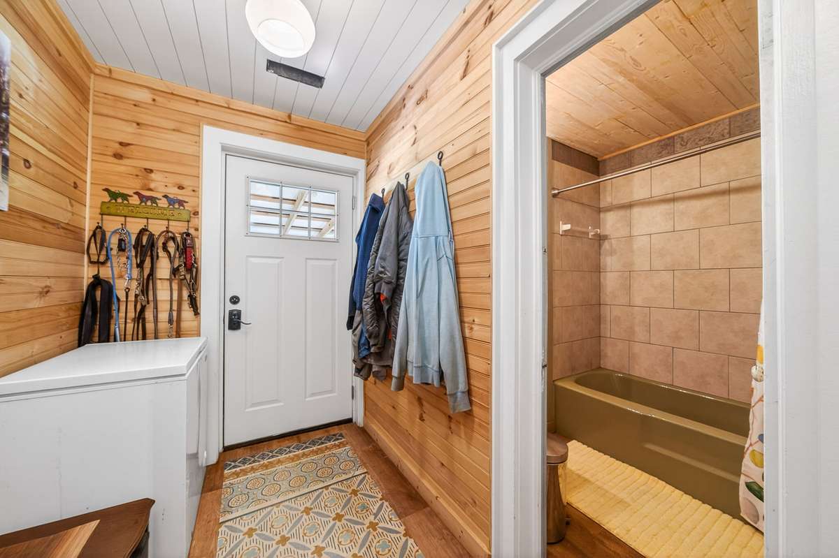 Door to back porch and entrance to bathroom
