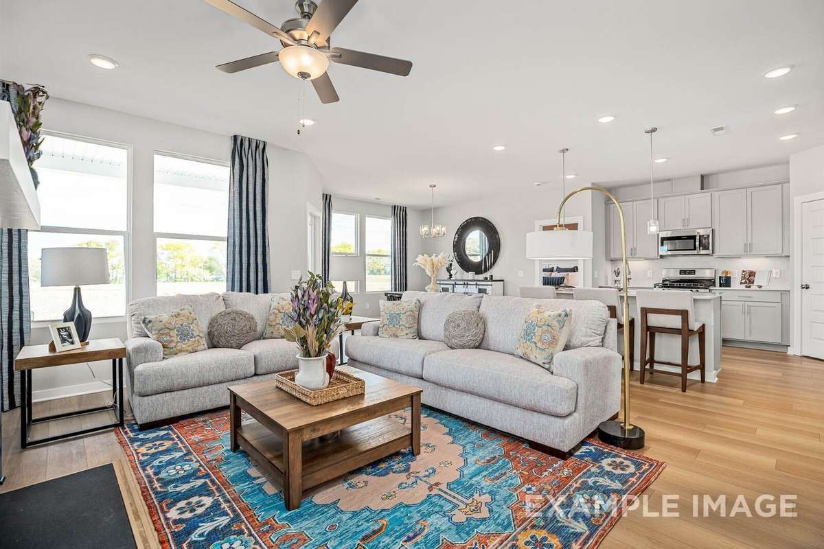 Picture of actual home being sold.  Furniture is being removed, but curtains and appliances are being sold with home