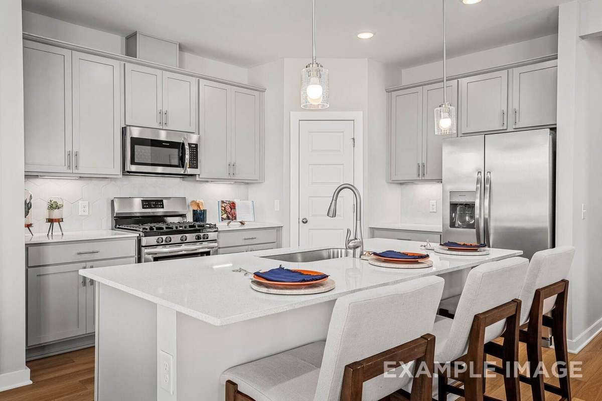 Picture of actual home being sold.  Furniture is being removed, but curtains and appliances are being sold with home