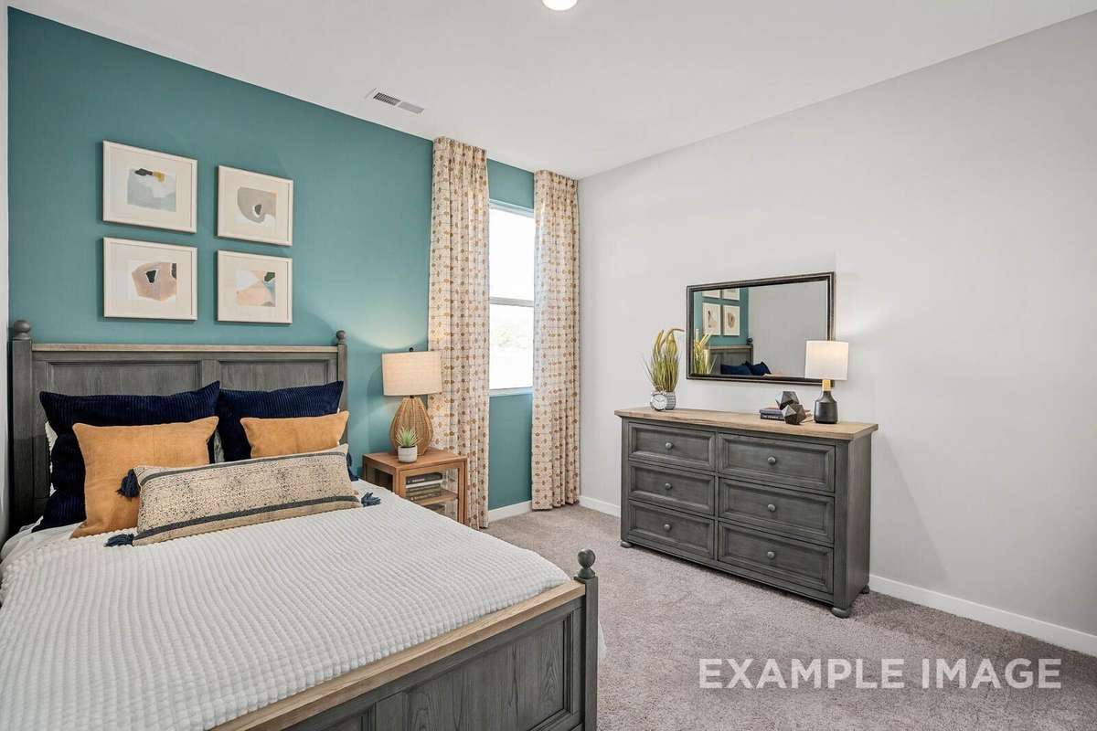 Picture of actual home being sold.  Furniture is being removed, but curtains and appliances are being sold with home