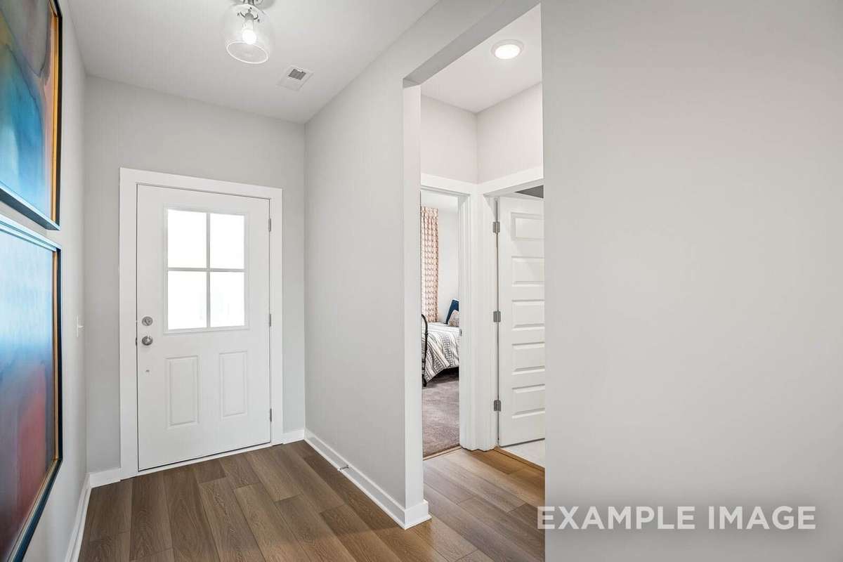 Picture of actual home being sold.  Furniture is being removed, but curtains and appliances are being sold with home