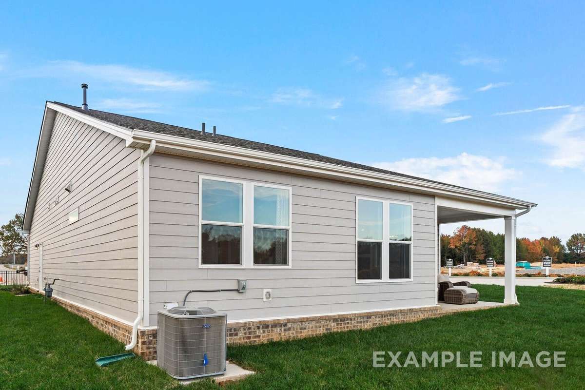 Picture of actual home being sold.  Furniture is being removed, but curtains and appliances are being sold with home