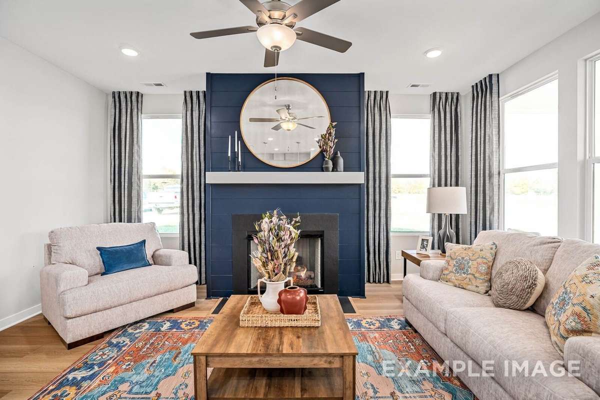 Picture of actual home being sold.  Furniture is being removed, but curtains and appliances are being sold with home