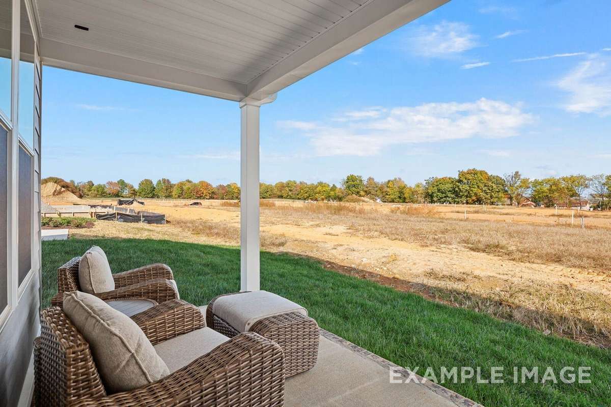 Picture of actual home being sold.  Furniture is being removed, but curtains and appliances are being sold with home
