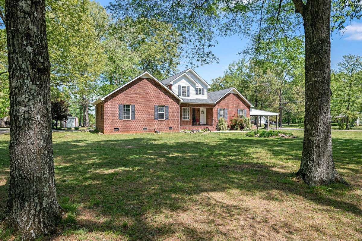 Another view of house and carport.