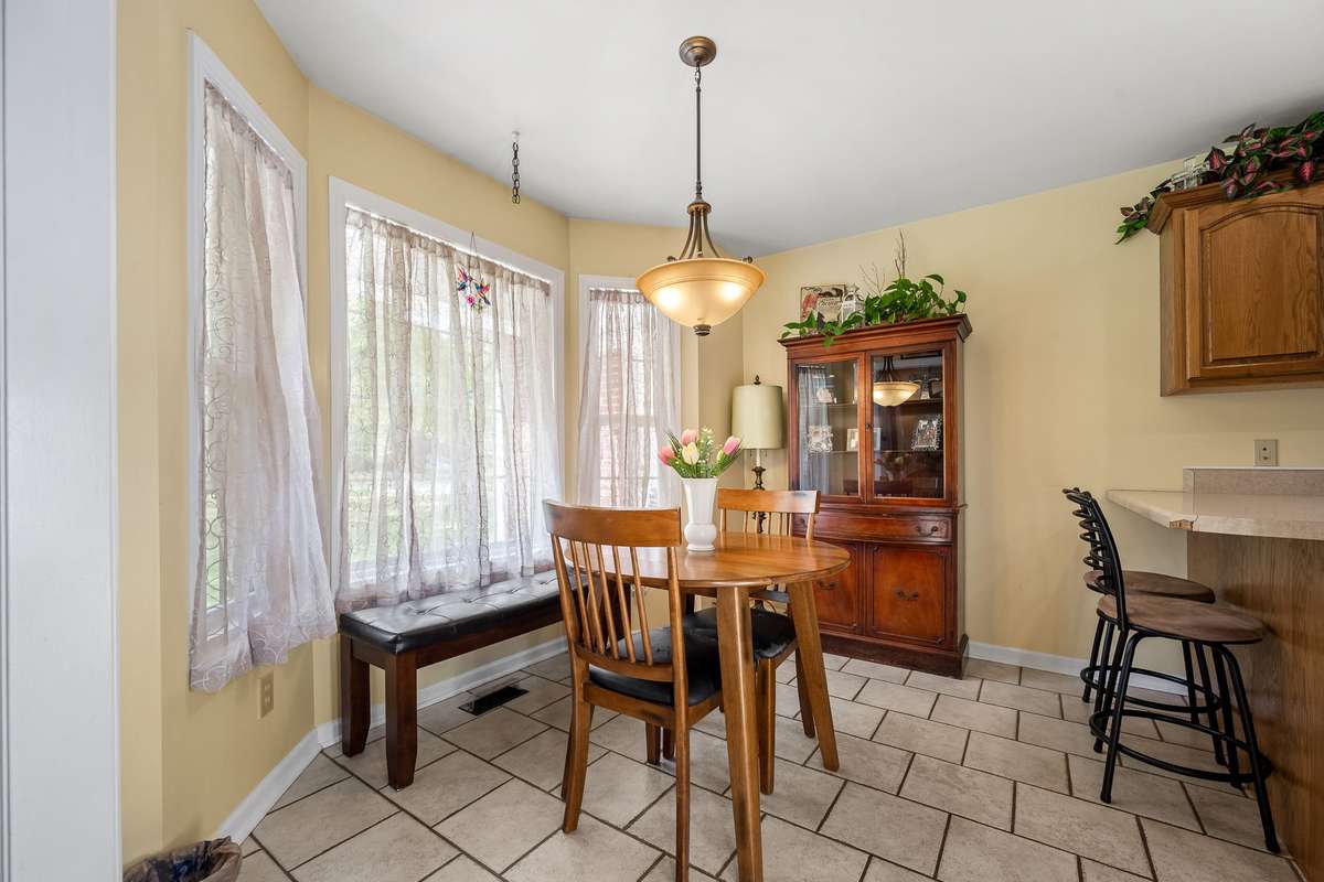 Breakfast nook has bay window.