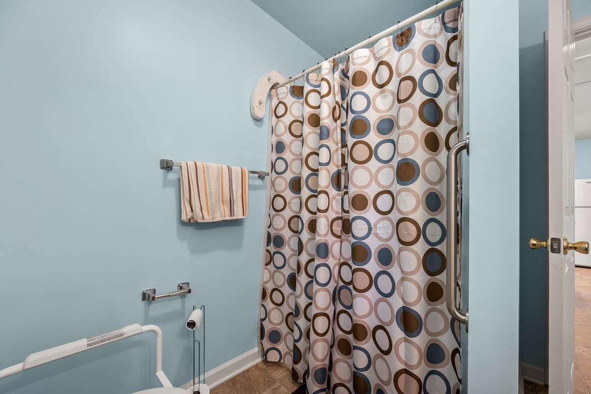 Bath has walk-in shower that is handy-cap accessible.