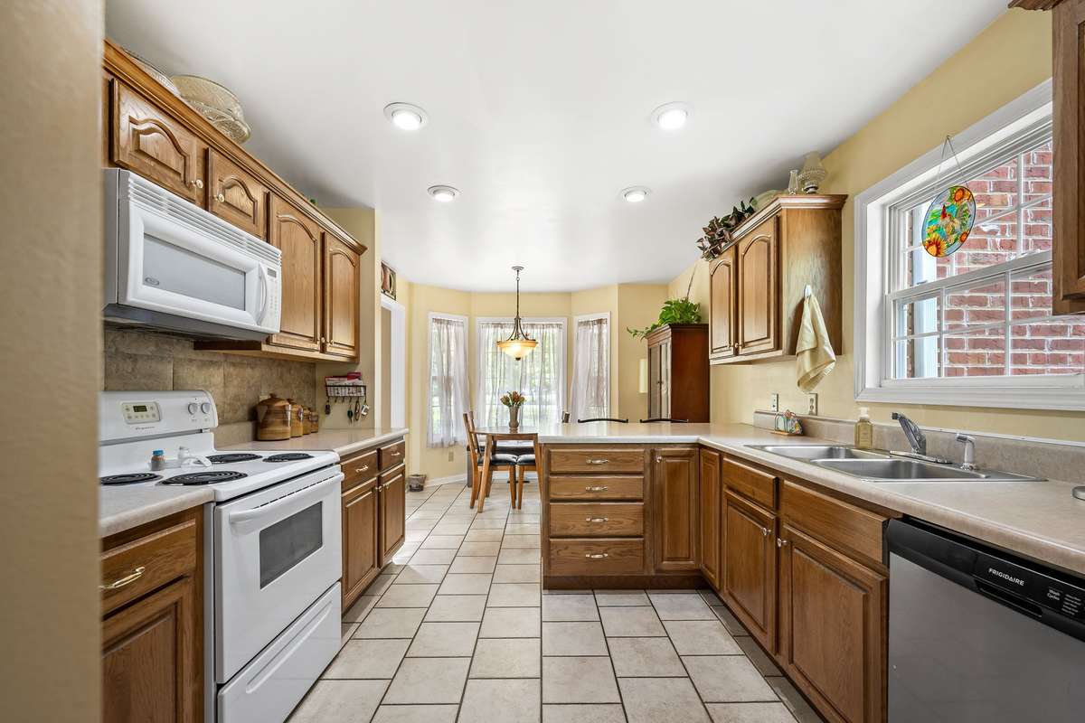 Kitchen has tiled floors.