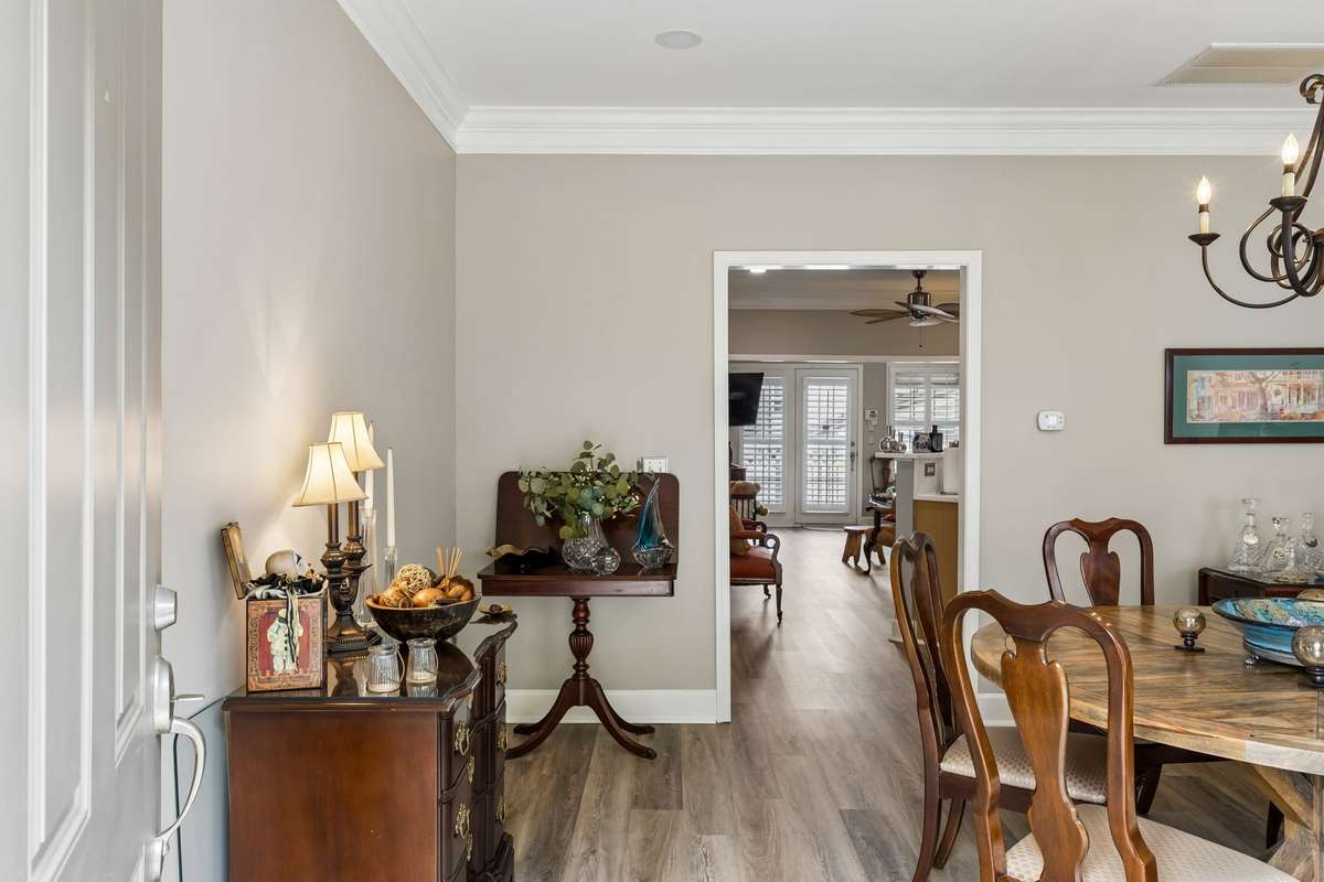Through the front door is the main living area, which the seller has used as her dining room because of her collection of large dining room furniture.