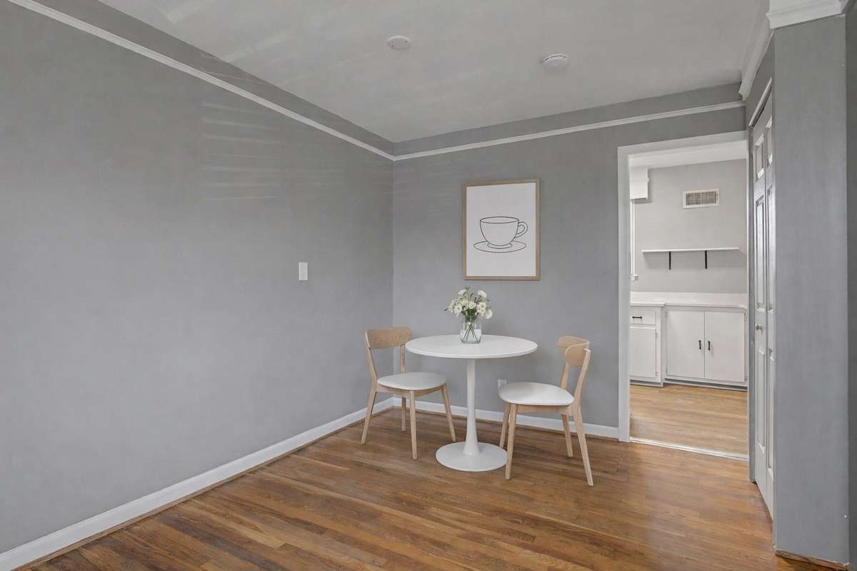Dining area next to kitchen with virtual staging