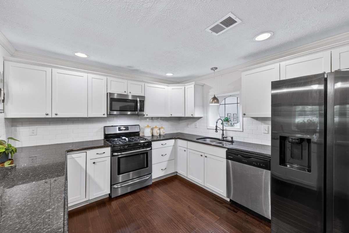 Beautiful updated kitchen with granite countertops and stainless steal appliances