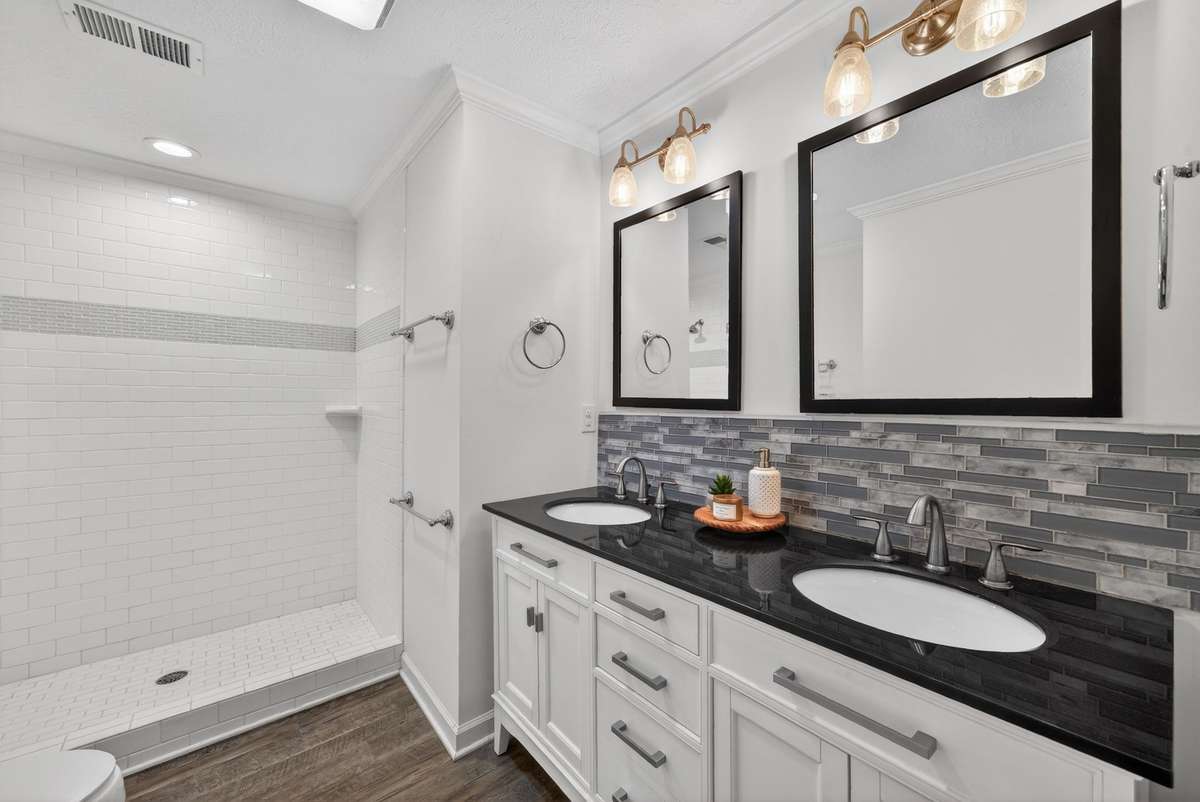 main level bathroom with walk in tile shower