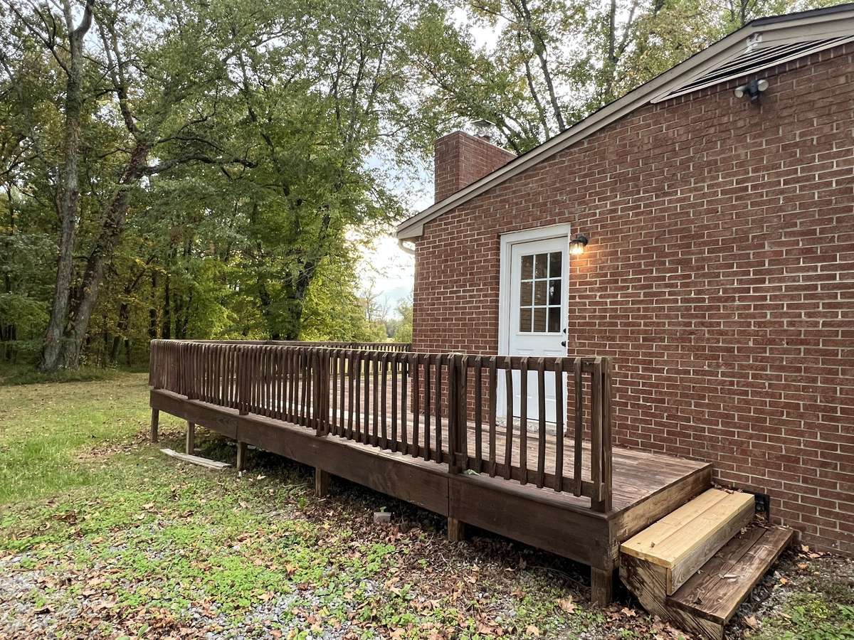 The Deck: The deck wraps around and has a great side door access for getting things out of your car and into the kitchen.