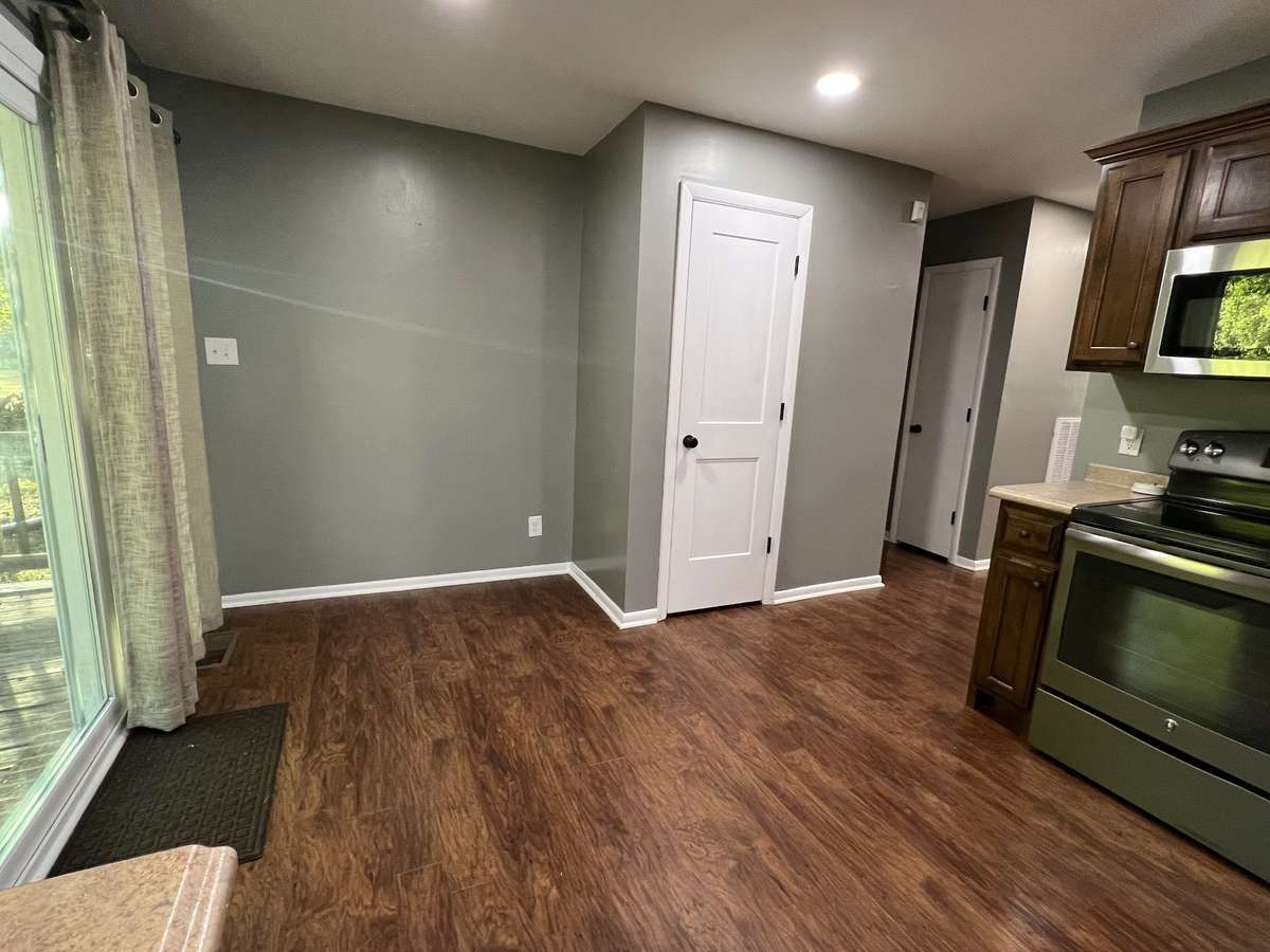The sun shining through the sliding glass door into this room can only be truly experienced in person. No matter what time it is this house glows with warmth and peace.