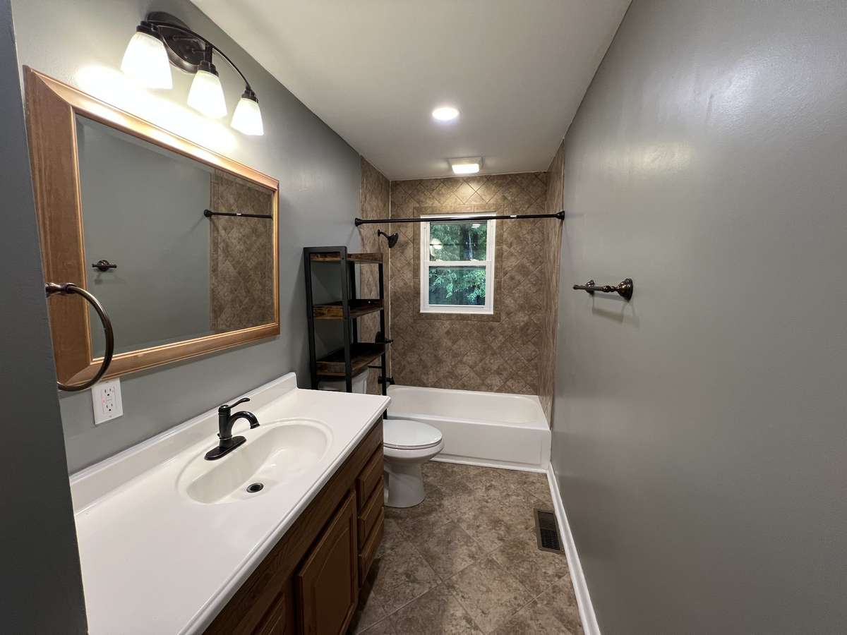 Full Bath: This bathroom provides ample room for all your daily needs. A large sink, shower/tub combo, and lots of room for storage make this full bath everything you're looking for.