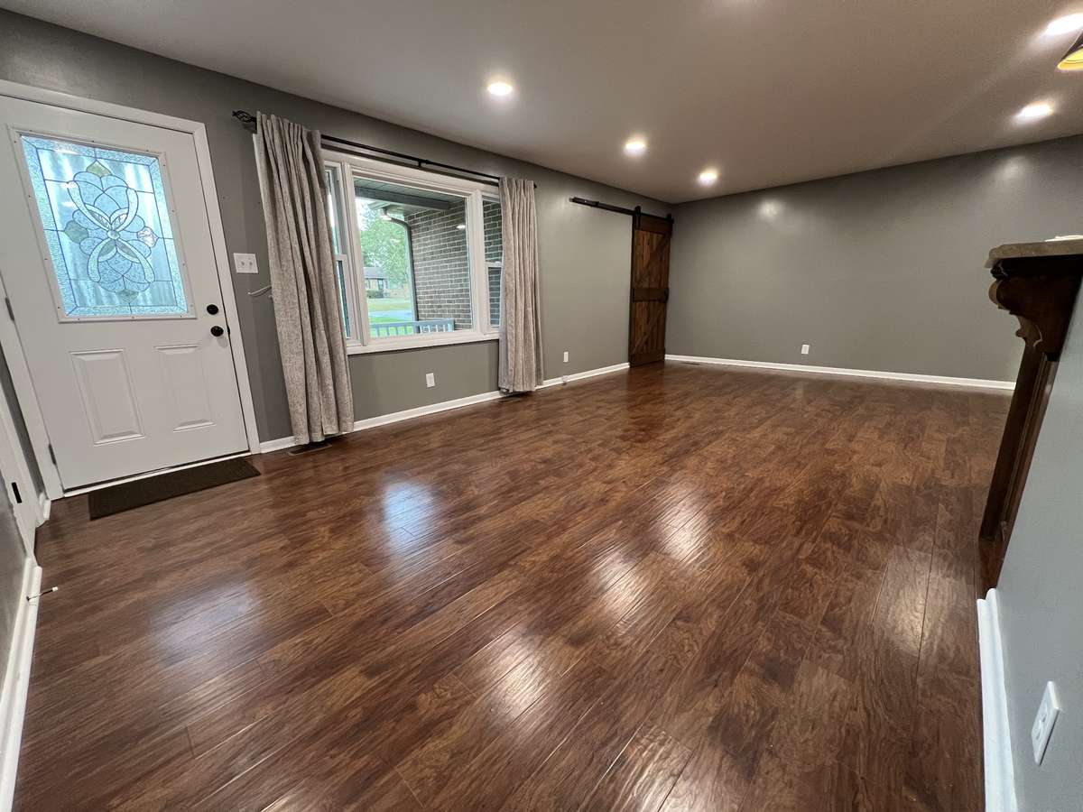 Walk in the front door into the beautiful open living room.