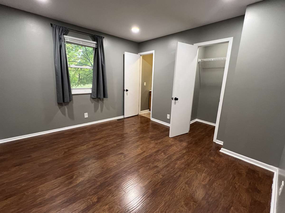 Bedroom 1: This primary bedroom is complete with a large closet and half bath.