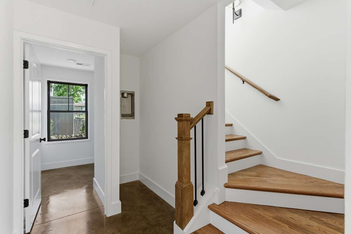 The lower level of the DADU includes a functional entryway with easy-to-maintain polished concrete floors.