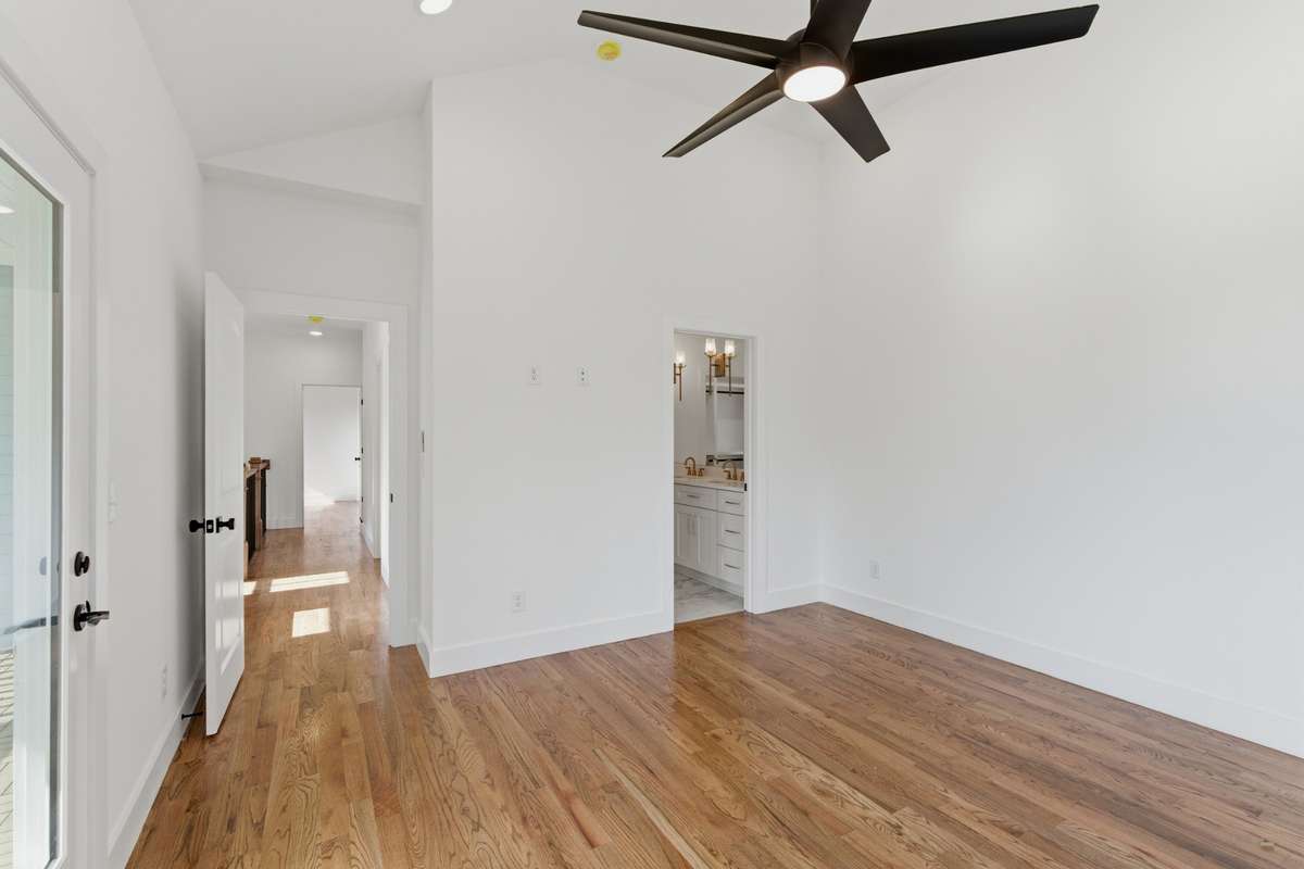 This spacious retreat is designed for relaxation, with a natural flow into the luxury primary bath.