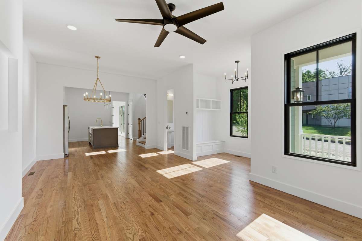Warm walnut hardwoods run throughout the entire home, creating a seamless and high-end feel.