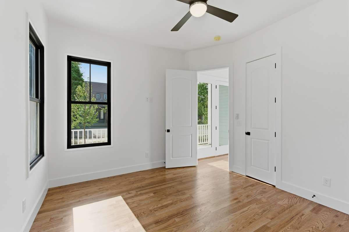 This versatile space is tucked away in the back of the home for privacy, making it an ideal spot for visitors or a quiet home office.