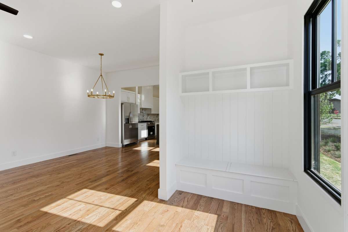 The built-in mudroom bench and cubbies provide an organized spot for bags and shoes right as you walk in.